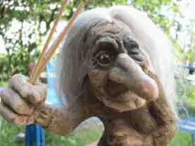 troll woman with stick